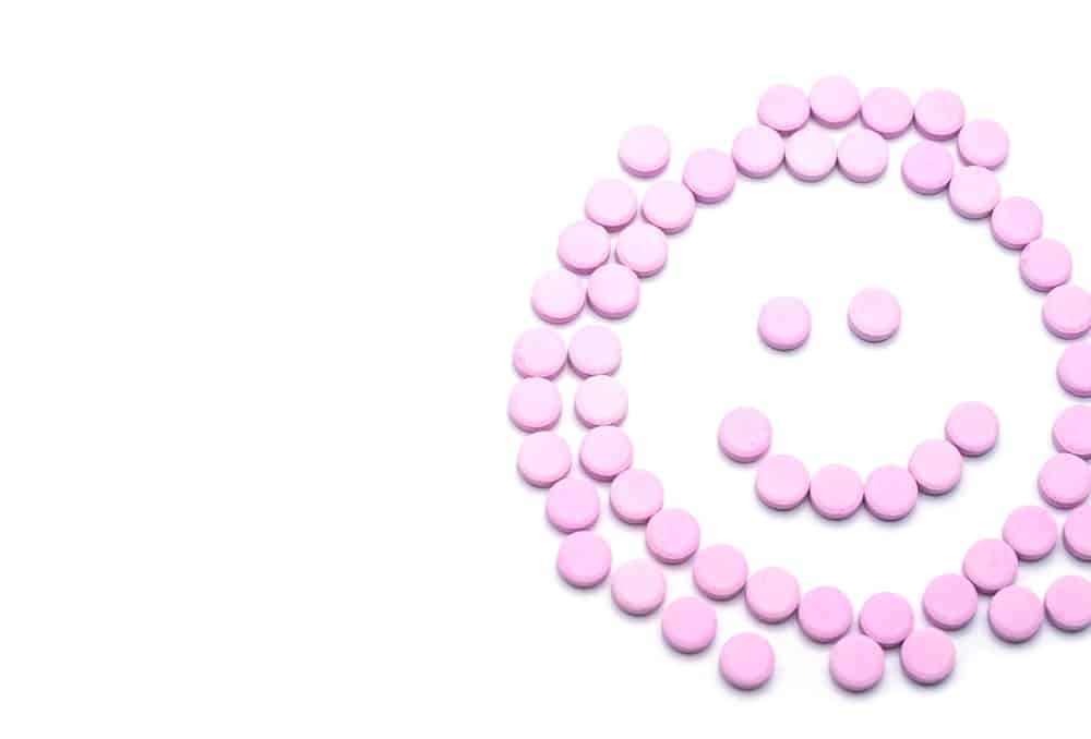 Birth control pills in the shape of a smiley face