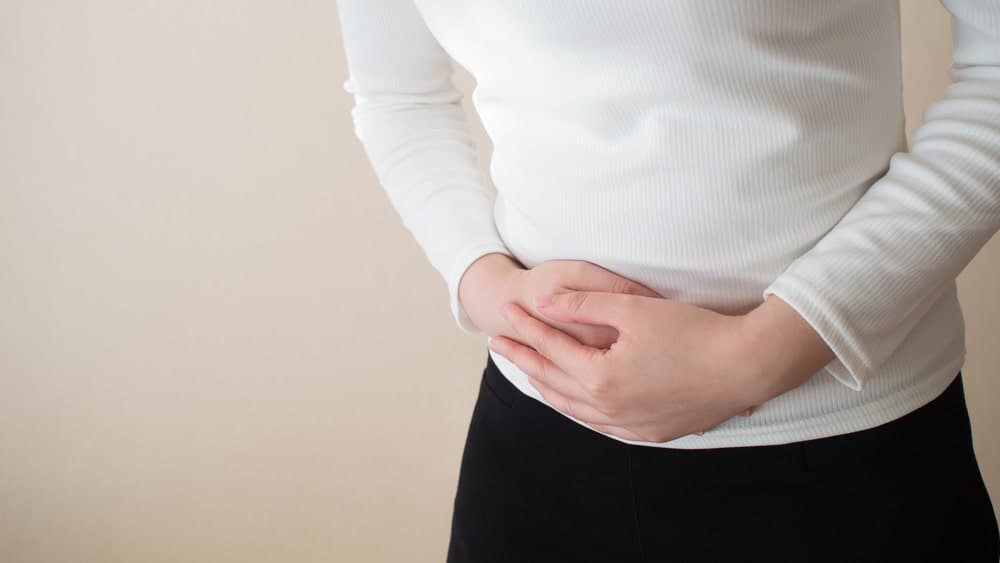 Lowering risk of ovarian Cysts - Holding stomach